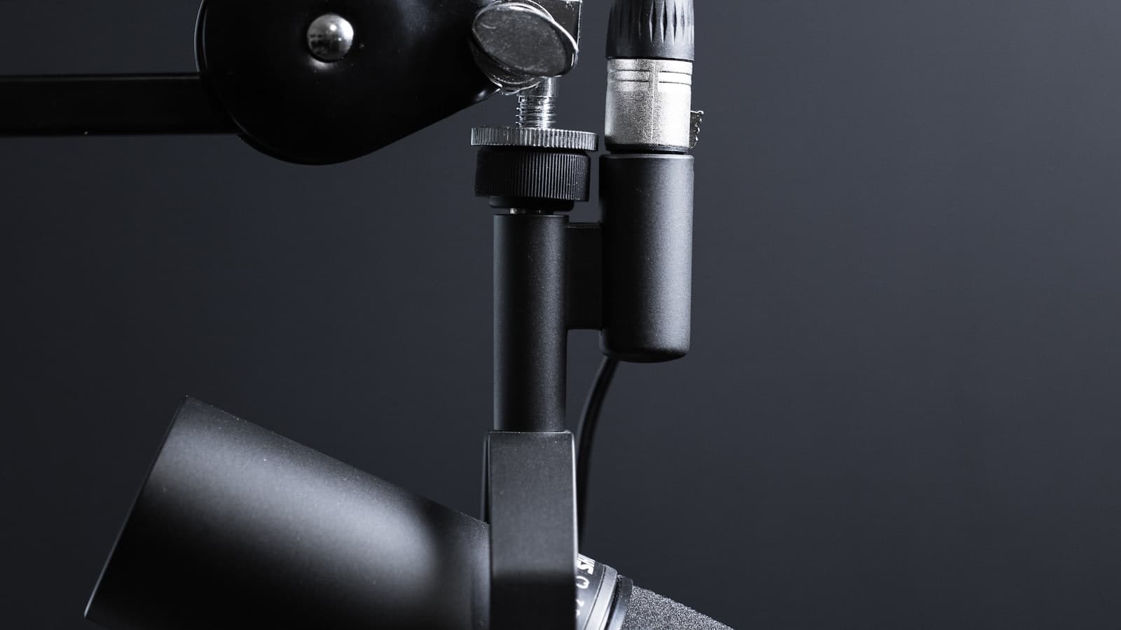 Studio condenser microphone on a boom arm in a recording setup