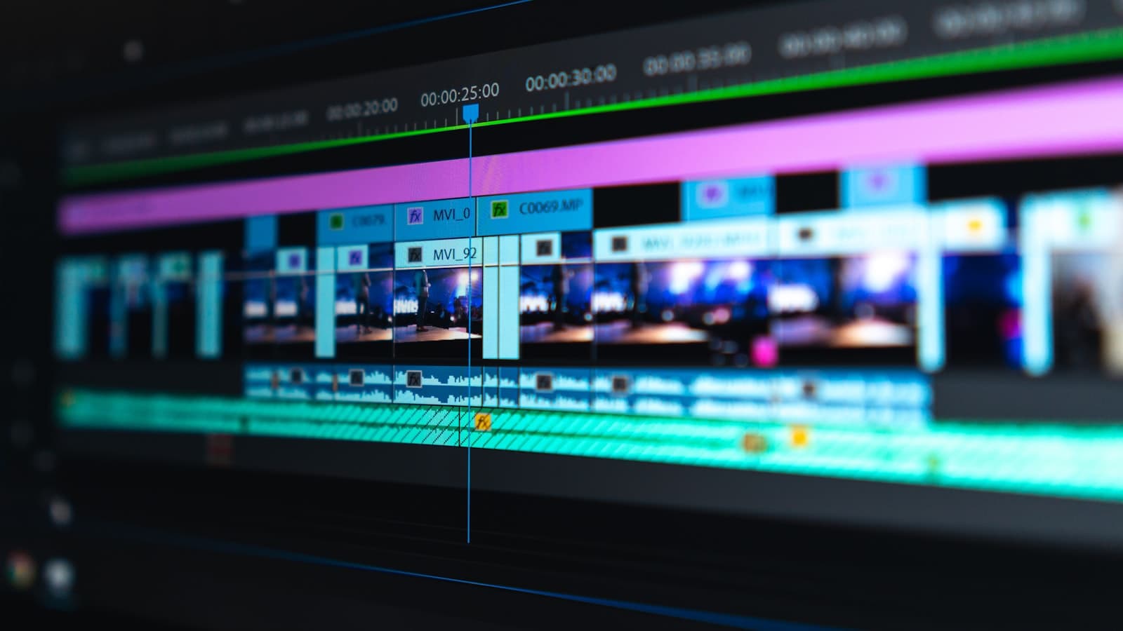 Colorful video editing timeline showing many small clips arranged on multiple tracks